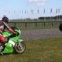 Photographing a motorcyclist.